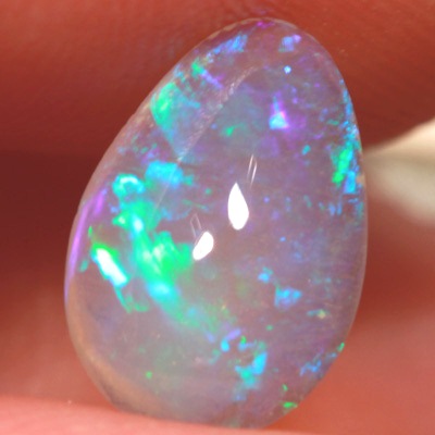SOLID CRYSTAL OPAL Rolling flashes of green play in a 3D pattern 